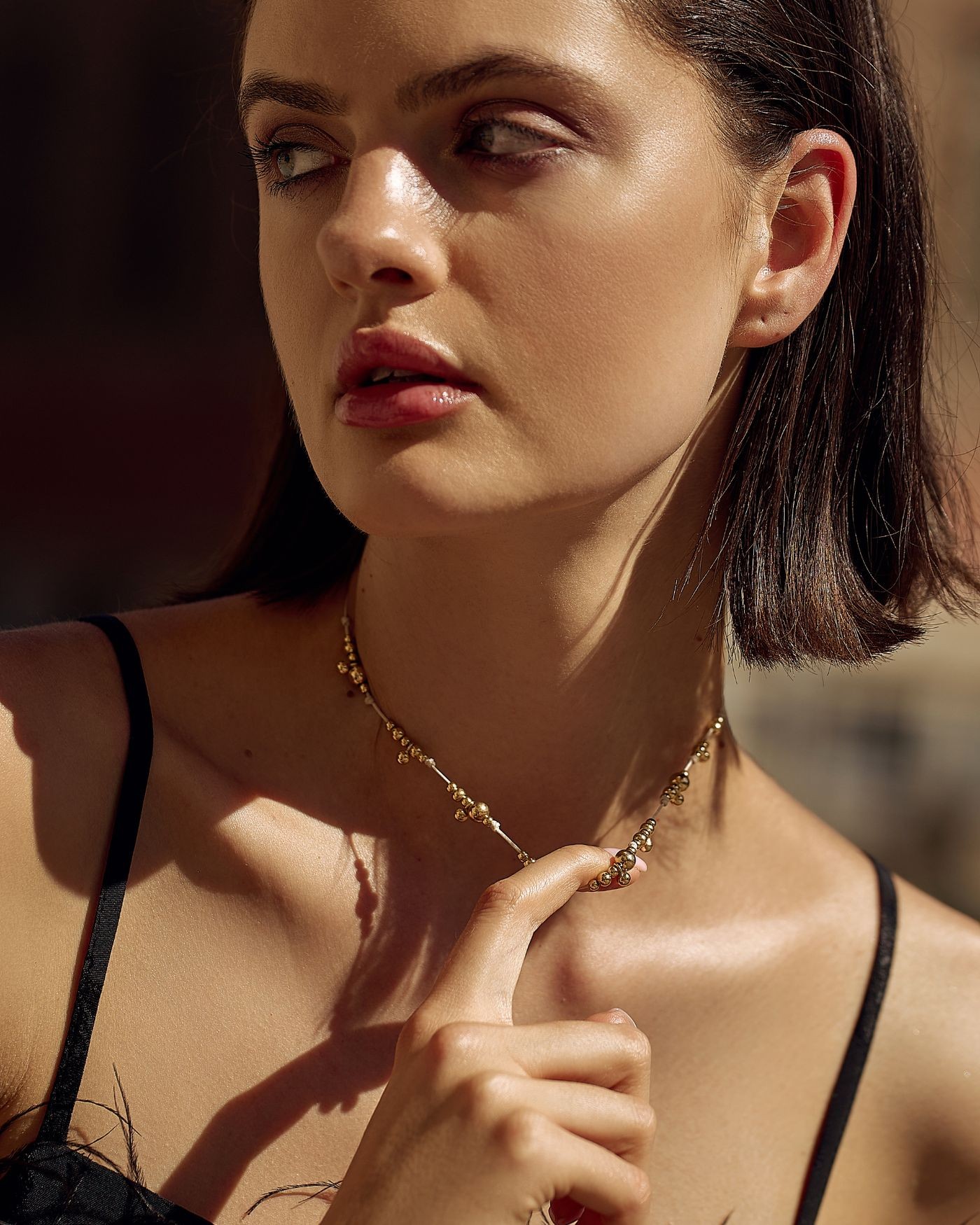 Necklace on beige cord with gold-gilded beads  - 1