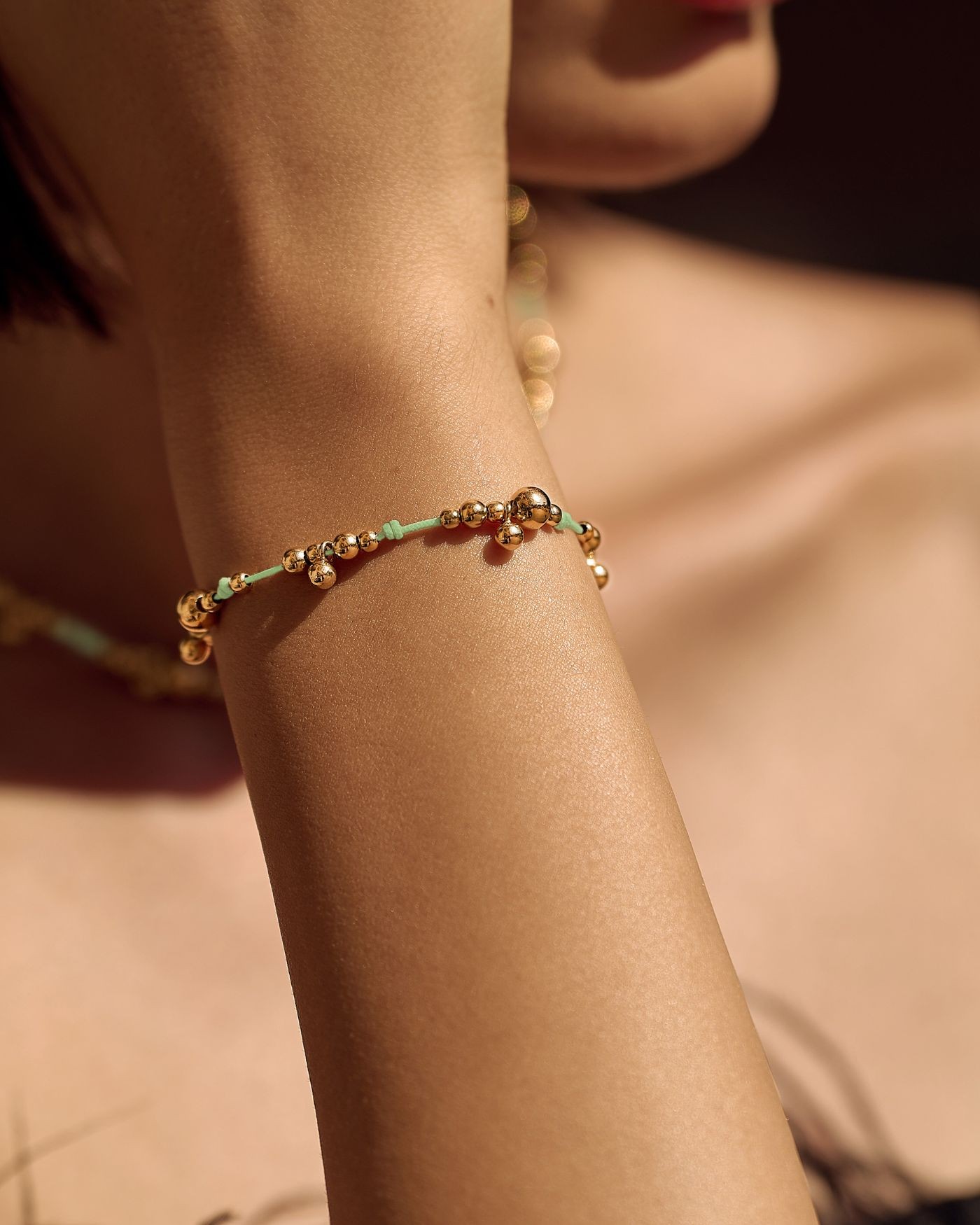 Bracelet on mint cord with gold-gilded beads  - 1