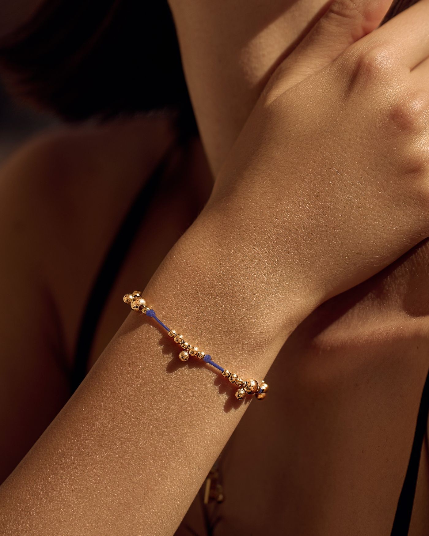 Bracelet on blue cord with gold-gilded beads  - 1