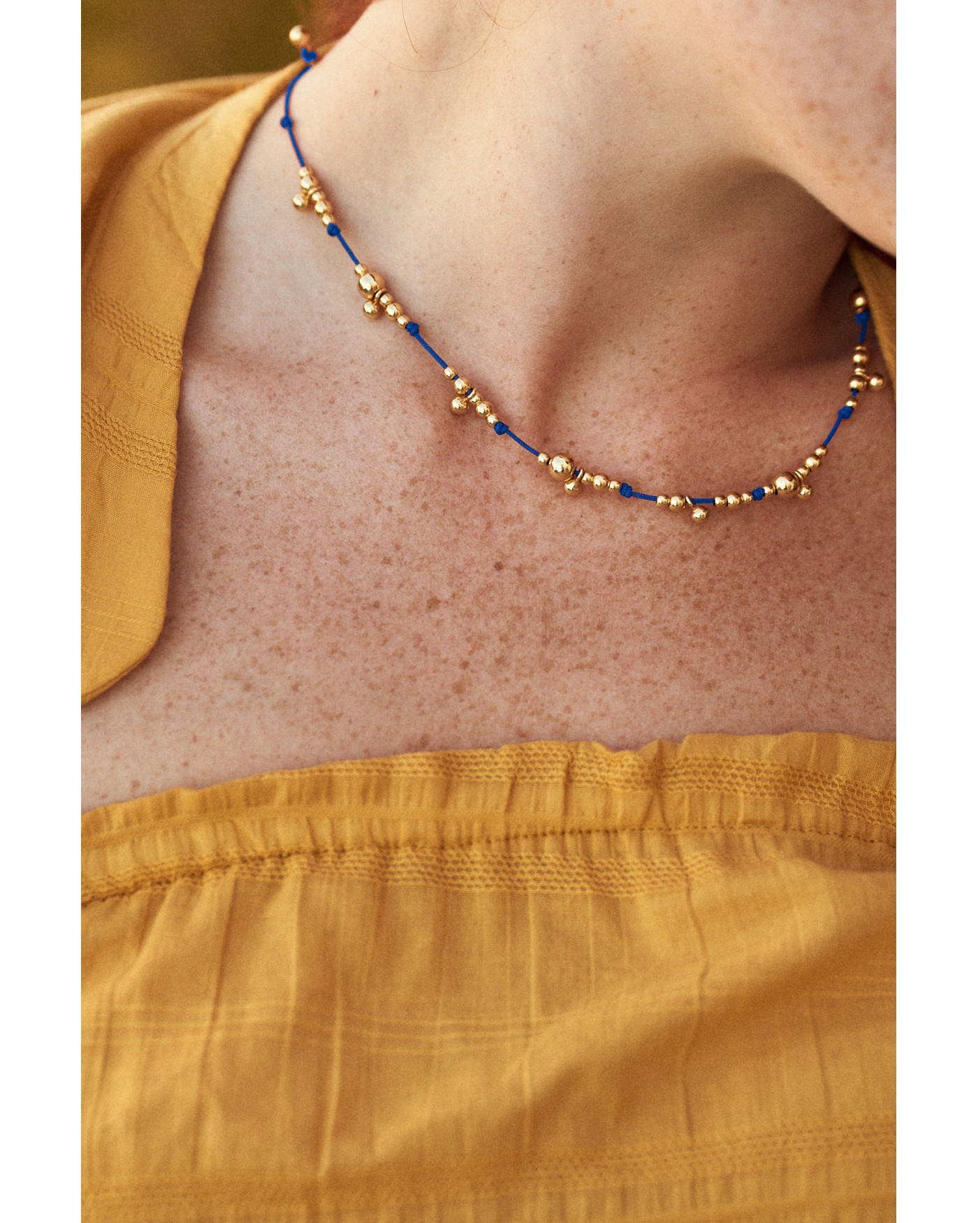 Necklace on blue cord with gold-gilded beads  - 4